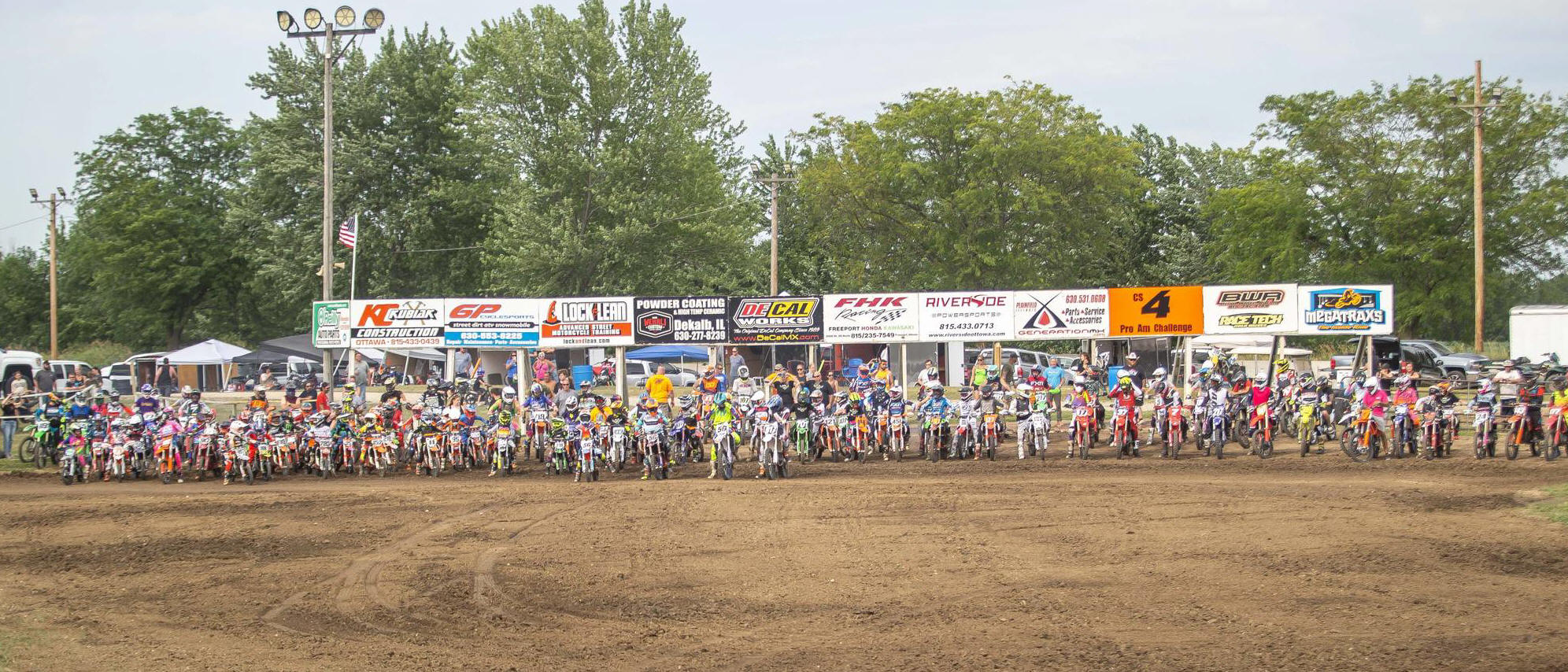May be an image of 3 people and dirt bike